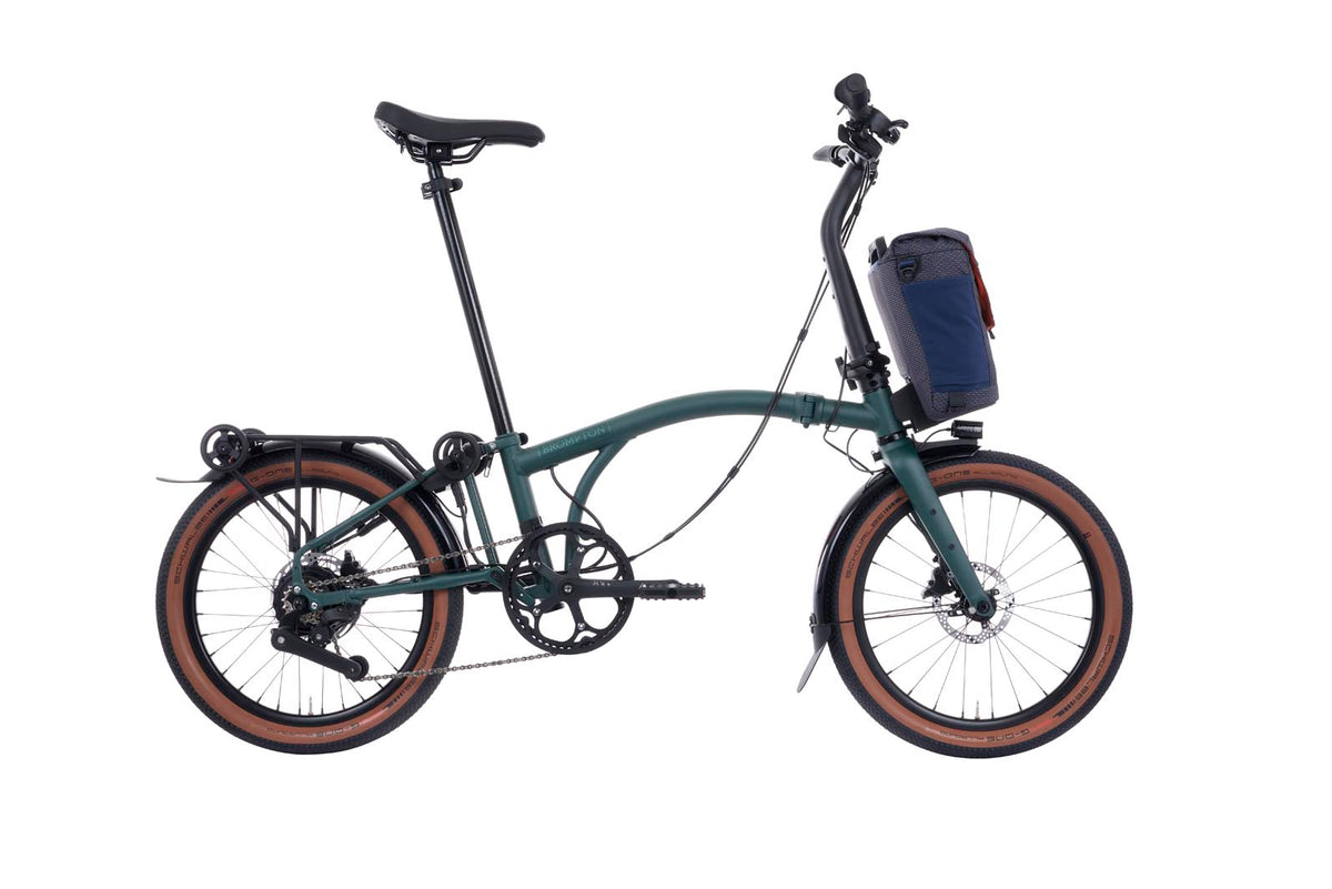 Brompton Electric G Line in forest green — full side view with front bag