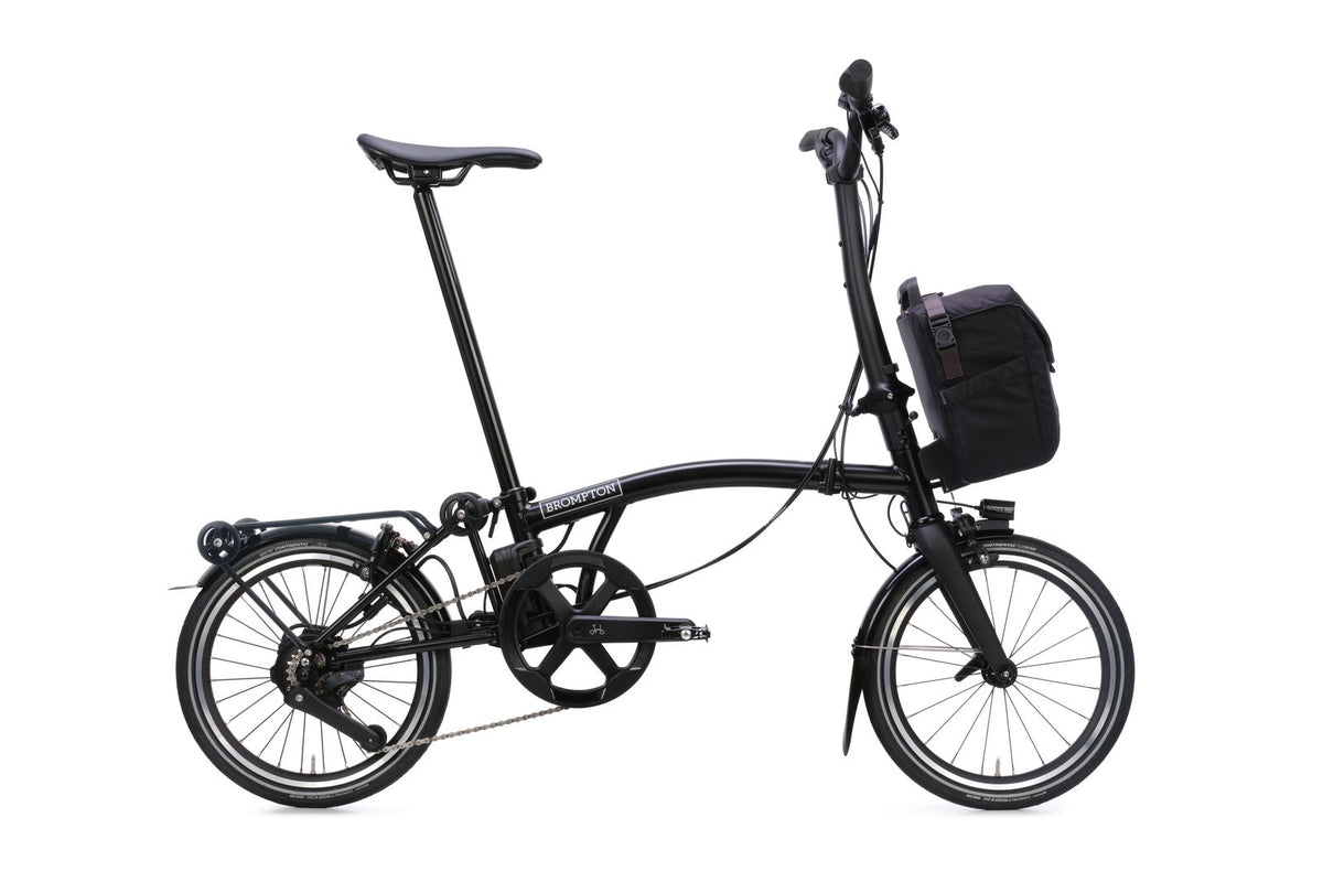 Brompton Electric P Line in matt black — full side view with front bag