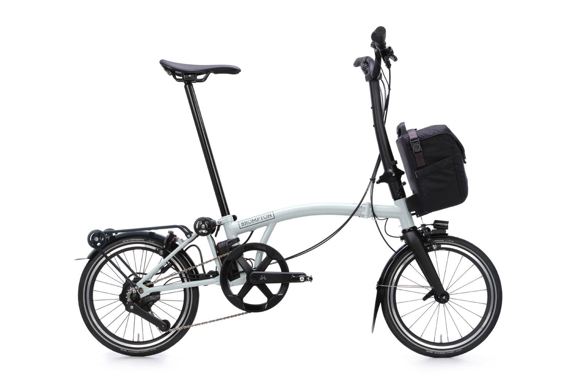 Brompton Electric P Line in lunar ice metallic — full side view with front bag