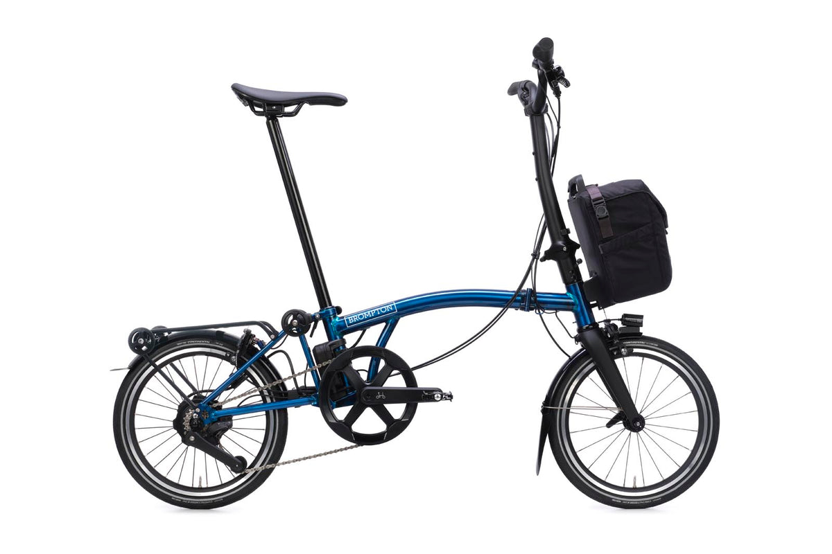 Brompton Electric P Line in pacific blue lacquer — full side view with front bag