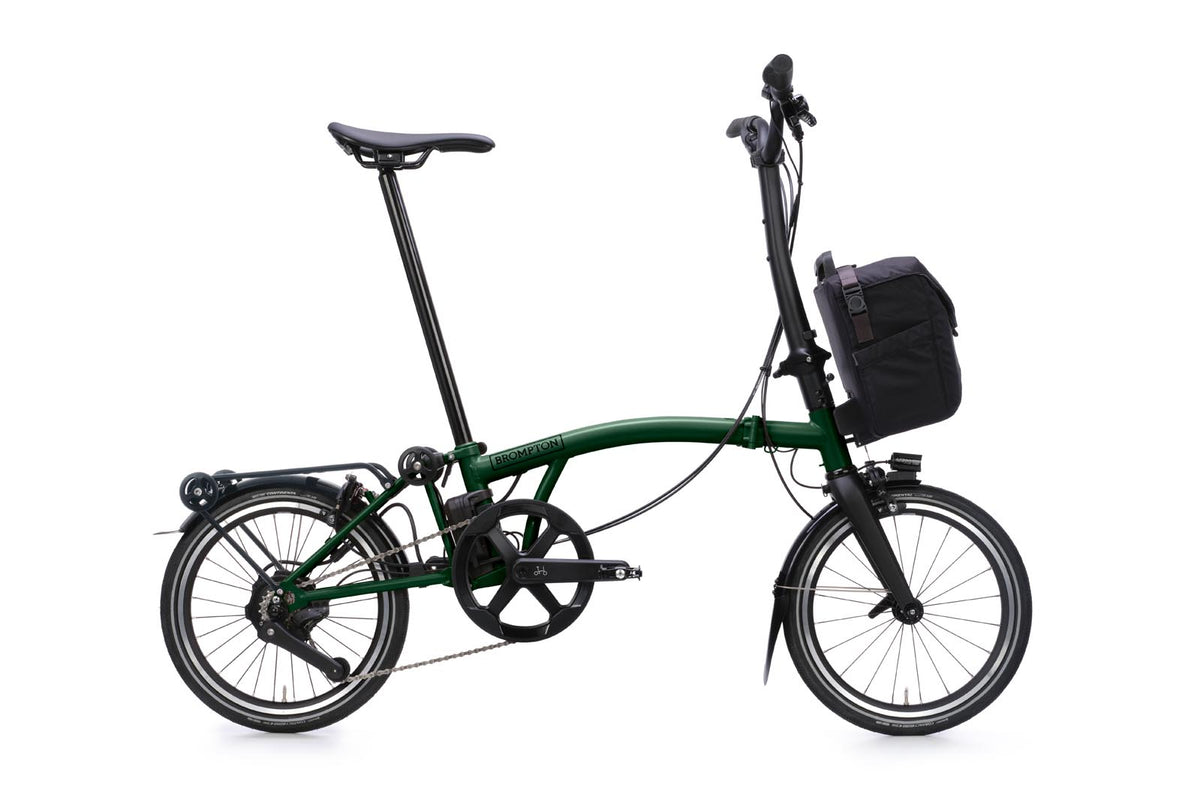 Brompton Electric P Line in racing green — full side view with front bag