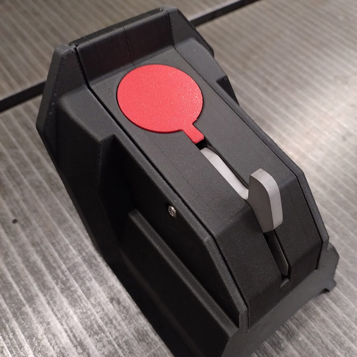 Kattfix lock unit for the Urban Arrow with its round red cover and release lever
