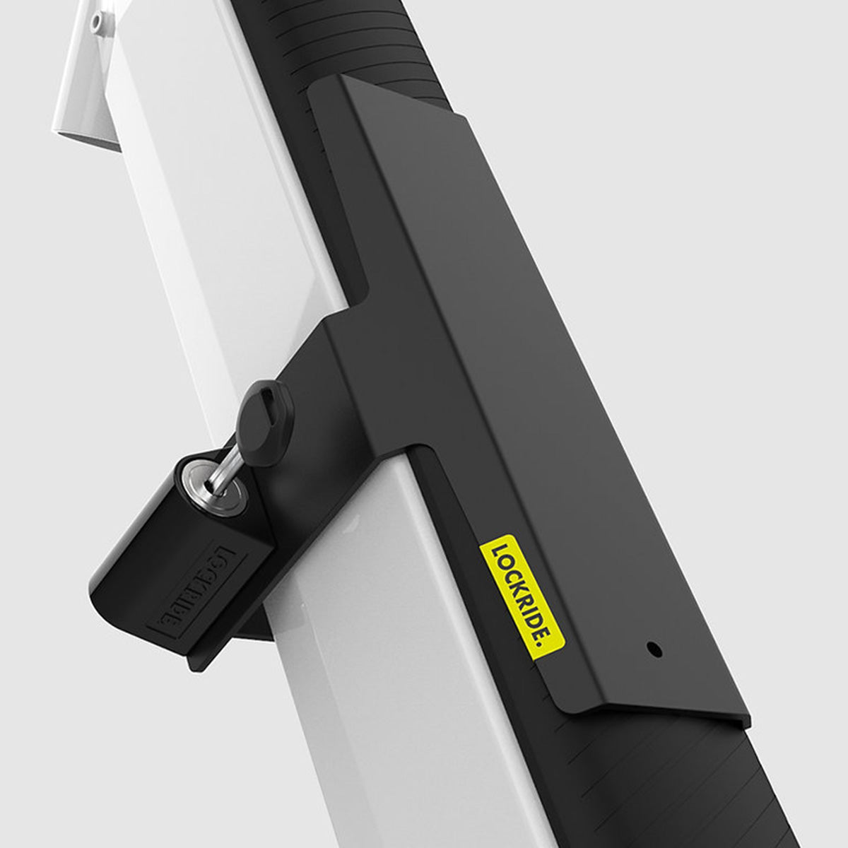 Lockride Z-Series lock mounted along a white Bosch rack battery, with the padlock and key fitted
