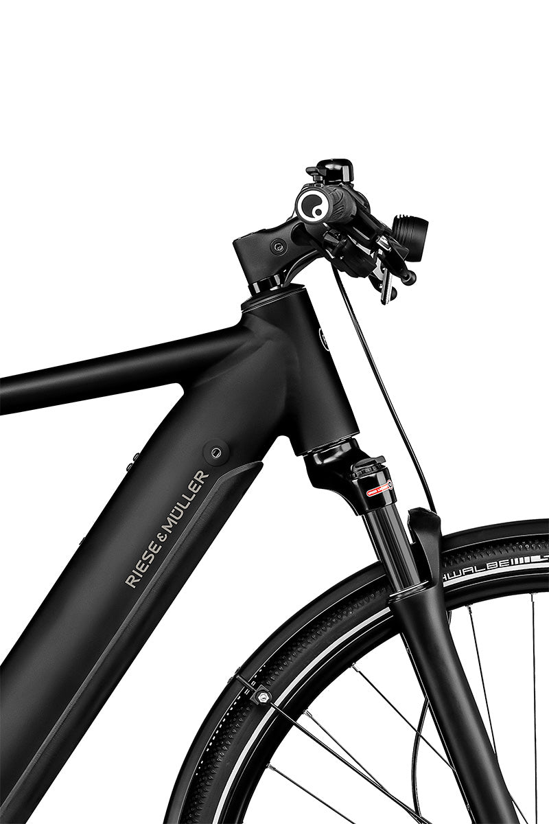 Riese & Müller Roadster in black matt — front end with integrated front light, bell and suspension fork